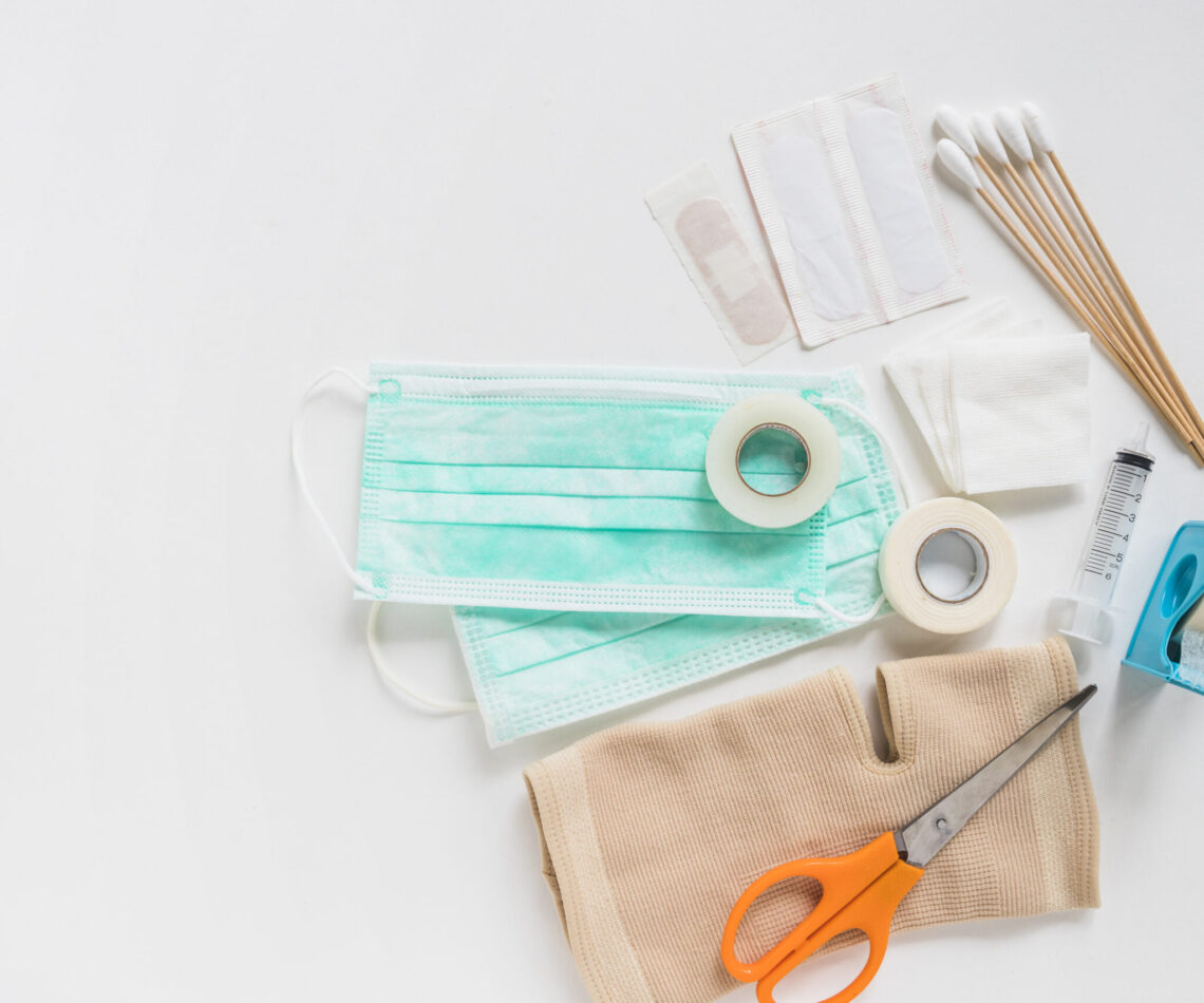 surgical-mask-bandage-gauze-cotton-swabs-sticky-bandage-knee-brace-with-scissor-white-background